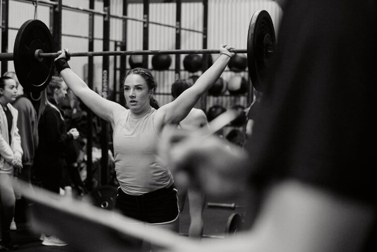 Physiotherapist Katherine Lee lifting weights as part of a breast cancer recovery program
